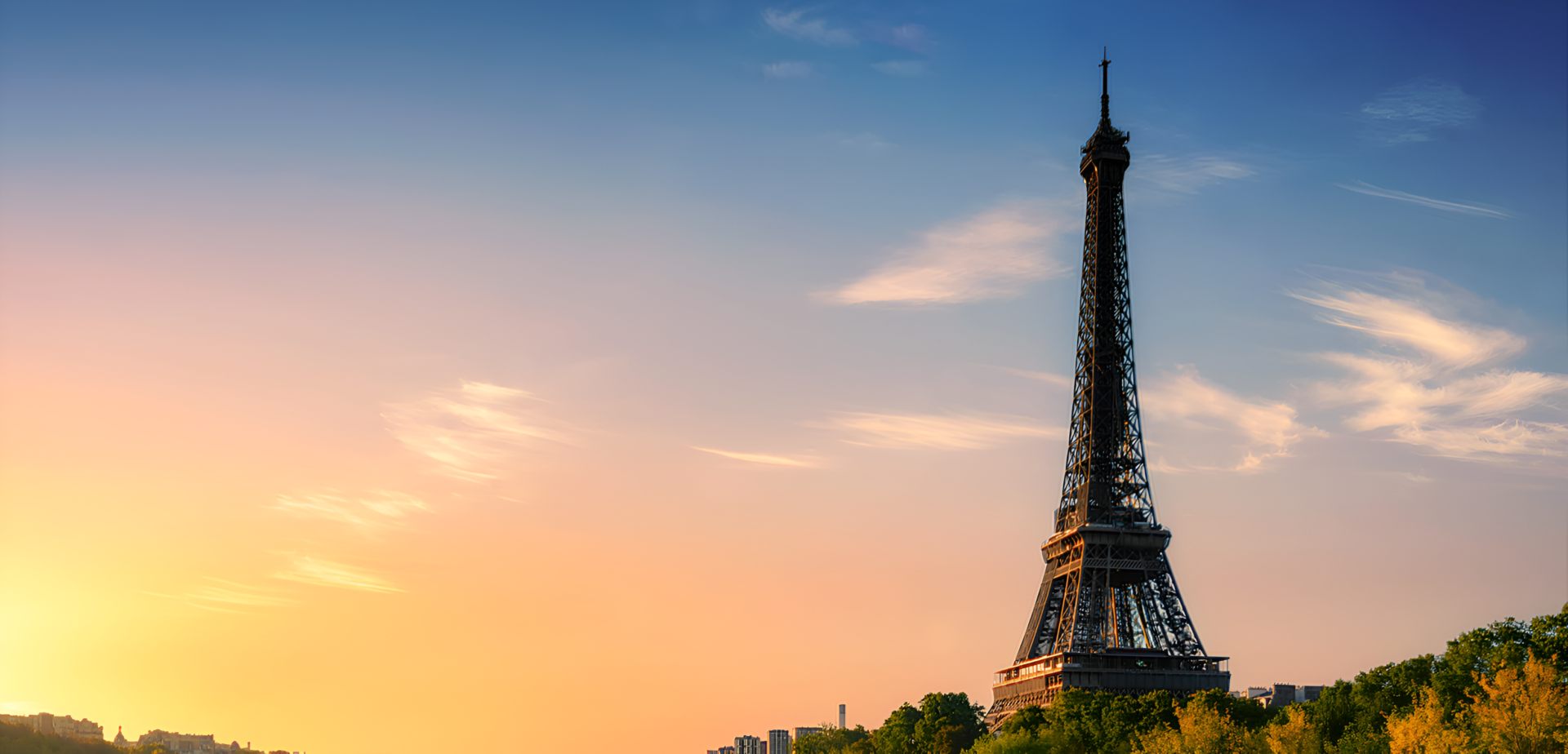 Eiffel Tower at sunset with a colorful sky.